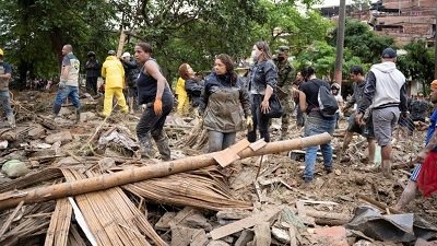 Rescue teams have been searching in the mud and debris for more survivors