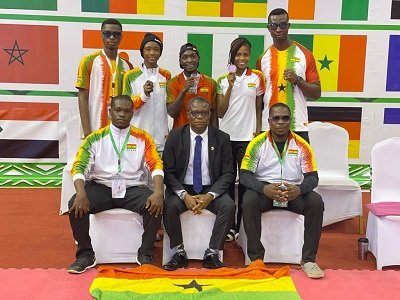 Mr Lartey Otu (in suit) with members of Team Ghana