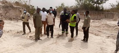 Mr Lugudor (second from left) and other officials at degraded land