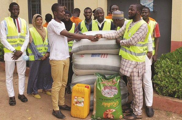 Dr Alhassan (right) presenting the items to ASP Musah Alhassan