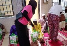 (inset) Health zone members distributing food packs to the worshippers in the Mosque