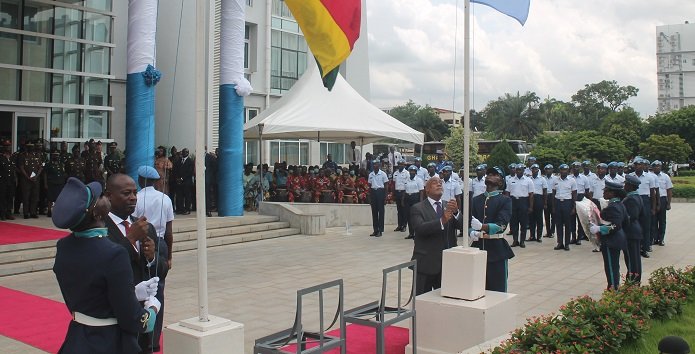 Mr Thomas Mbomba (left) and Mr Charles Abani hoisting Ghana and UN flags respectively to mark the day. Photo Godwin Ofosu-Acheampong