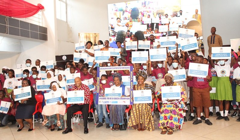 Dr Afisah Zakariah (seated third from right) with dignitaries and school children at the programme. Photo. Ebo Gorman