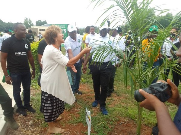Ms Quintero and Mr Jinapor admiring one of the trees planted last year