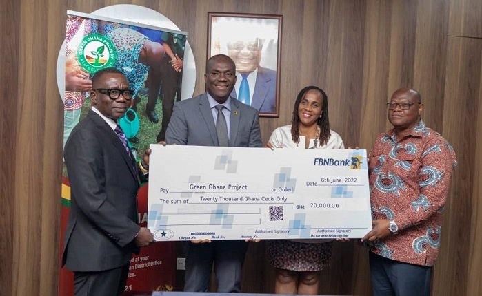 Officials of FBNBank (left) presenting a dummy cheque to a represenative of Ministry of Lands and Natural Resources
