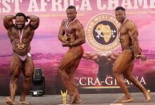 • Evans Amwagsi (middle) in a pose with other competitors after receiving his trophy