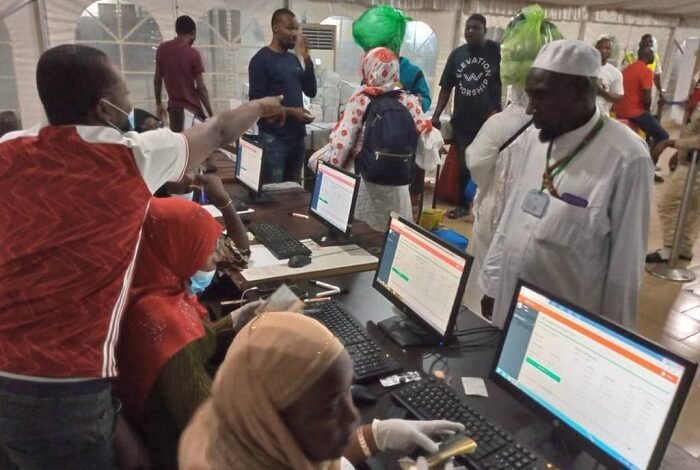 • The pilgrims going through the arrival formalities at the Hajj Village