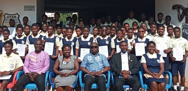 • Mr Agyapong-Boamah (middle) with the award winners and some staff of the schoolside