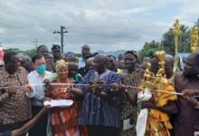 Vice President Bawumia( 3rd from left) being assisted to commission the road.