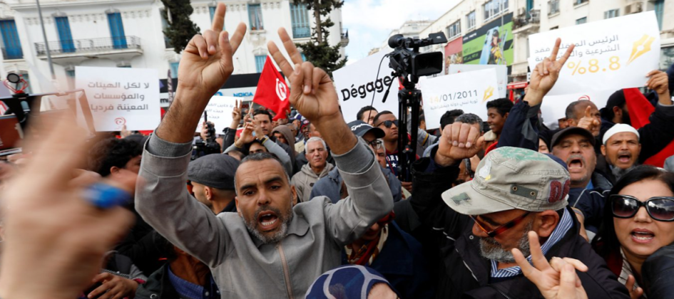 • Protesters push through police barricades in the capital, Tunis