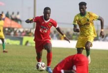 • Kotoko’s Richard Boadu (In red) controls the ball away from Michael Enu of Gold Stars