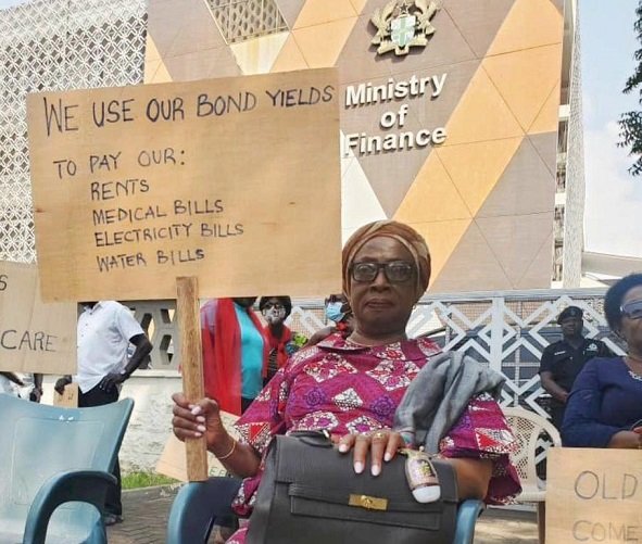 • Former Chief Justice Sophia Akuffo with a placard during the picketing