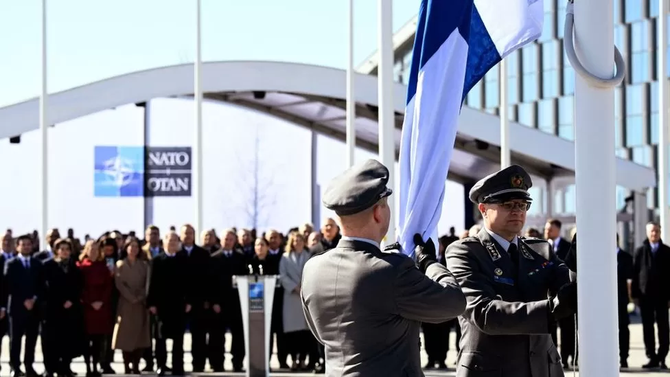 • Finnish military personnel raised their country's flag at NATO headquarters for the first time