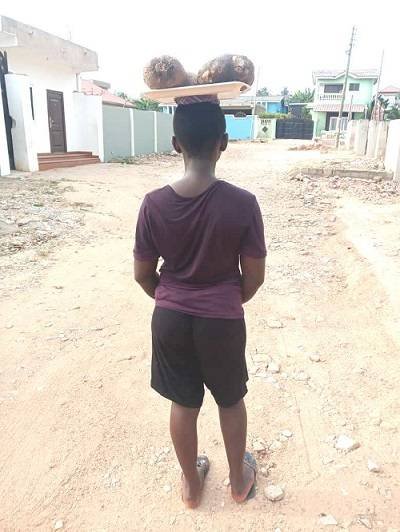 A girl selling yam