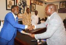 Mr Ernest Oti Akenteng(left)Chairman of New Juabeng North Constituency on behalf of Joe Ghartey receiving the form from Mr Evans Nimako,Director of Research and Elections