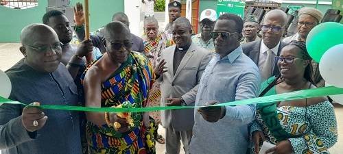 • Inset: Mr Ignatius Baffour Awuah (second right), Baffour Panyin Frimpong-Akomfohene of New Juaben Traditional Area (middle) and Mr Seth Kwame Acheampong cutting the tape to inaugurate the facility