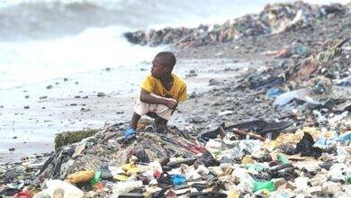 A child openly defaecating at a seashore in Tema Newtown, Accra