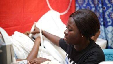 A pregnant woman undergoing the scanning process