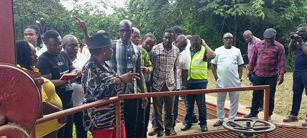 • Mr Paul Bawa (middle) briefing Ms Dapaah and other officials at the intake point