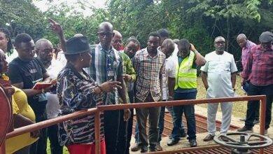 • Mr Paul Bawa (middle) briefing Ms Dapaah and other officials at the intake point