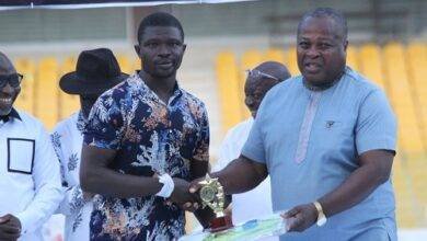 • Coach Alhassan receiving his award from Fred Pappoe (right)