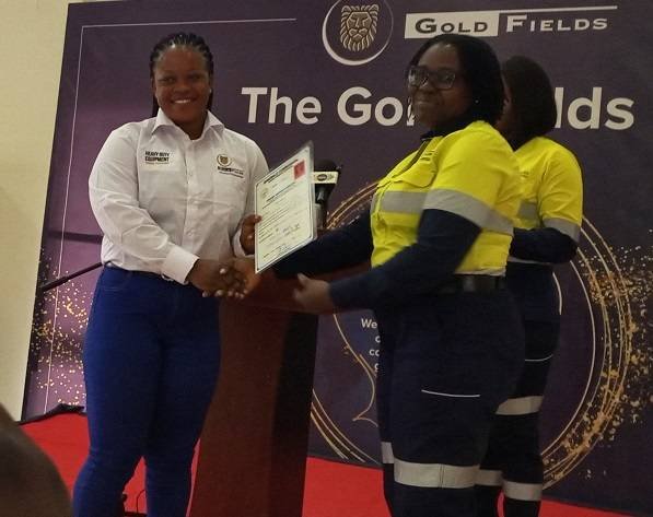 • Dr Allotey (right) presenting certificate to heavy duty machine trainee