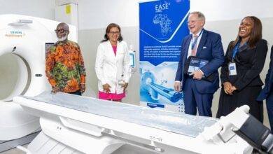 Mr Grant (left) and Dr Wulff (second from left) inspecting the CT scanner with . With them are Dr Oyeyinka (right) and Mr VanSchaik.