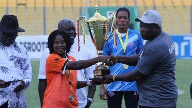 GARFA chairman, Mr Samuel Aboabire (right) presenting the trophy to skipper of Epiphany Warriors Gifty Acheampong