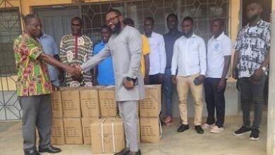 Mr Nde (right) in a handshake with Mr Imoro