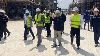 Mr K.T Hammond (middle) inspecting work on the refinery at Tema
