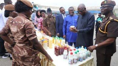 Mr Ambrose Dery(second from right) inspecting products manufactured by the inmates,with him are Isaac Egyir (right) and other dignitaries