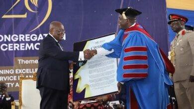 • President Akufo-Addo (left) receiving a citation from Prof. William Koomson