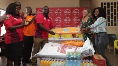 • Officials of Absa and Street Academy after the donation