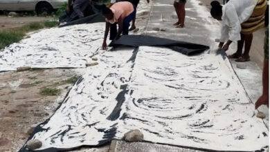 • Officials of the Assembly taking the contaminated maize flour away for destruction