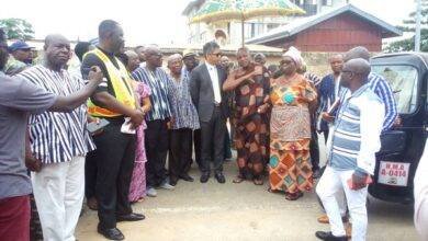 Togbe Afede inspecting the damage during a tour in the town