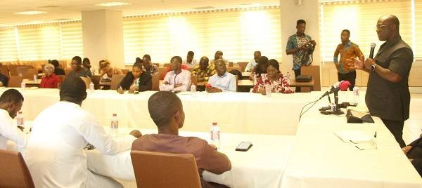 Mr Hassan Tampuli (standing) addressing journalists in the dialogue. Photo. Ebo Gorman