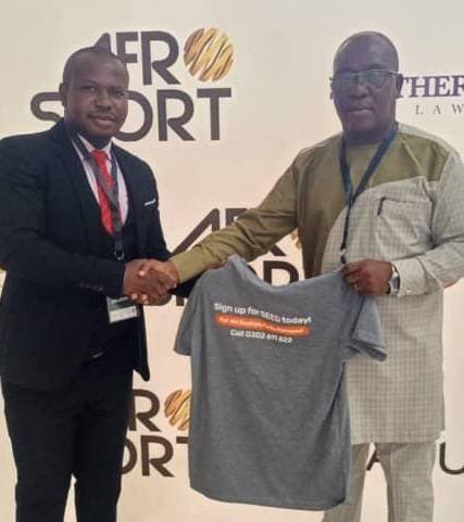 Mr Nkoo Joseph (left) presents a T-shirt to Mr Fianoo after the event