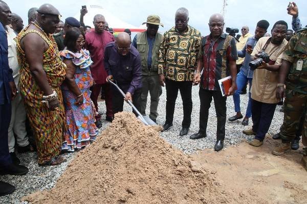 President Akufo-Addo (with shovel) cutting the sod for the commencement of work on the Pokuase housing project