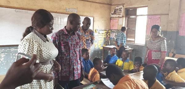 Professor Appiah (middle) interacting with some of the pupils