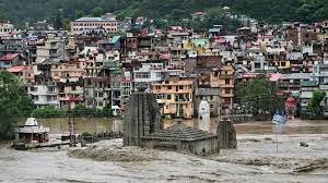 A temple is submerged in floodwaters after the river Beas overflowed in Mandi
