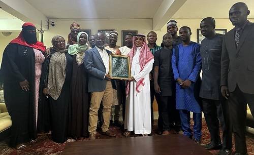 Alhaji Abdul-Samad (fourth from left) presents the citations to the Ambassador (in white)