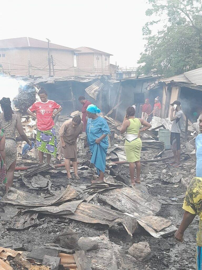 • Residents and fire personnel at the gutted area