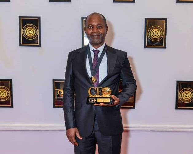 • Mr Clyde Adjei displaying the award
