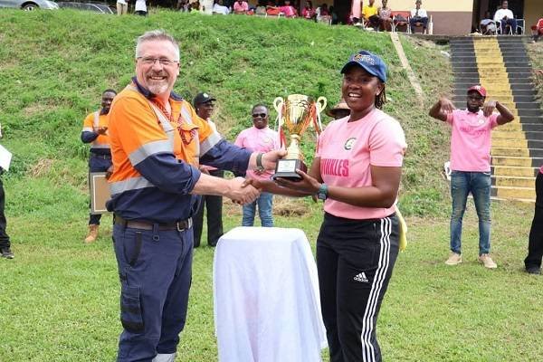 • Mr Darren Howard presenting the trophy to the Captain of Twinkle Ladies, Rhyda Ofori Amanfo