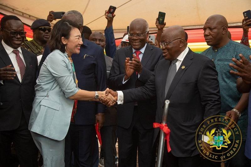 Ms Yang Yang (left) welcoming President Akufo-Addo