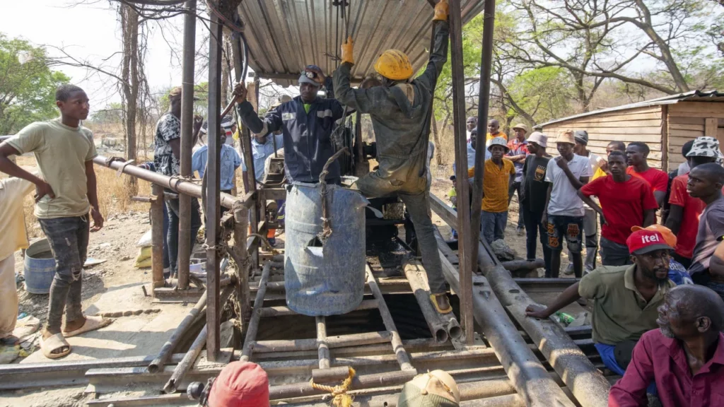 • Artisanal miners are seen during a rescue mission at the collapsed mine shaft.