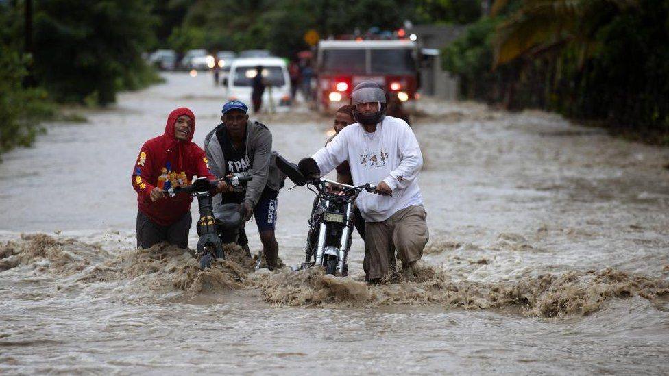 • A flooded road in San Jose de Ocoa, Dominican Republic