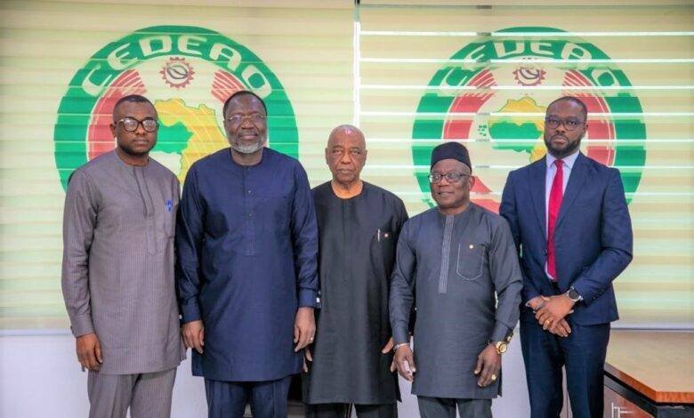 • Baba Kamara (middle) with Dr Omar Touray (second left), Dr Abdel-Fatau Musah (second right) and Mr Kpegah (right) at the ECOWAS Commission