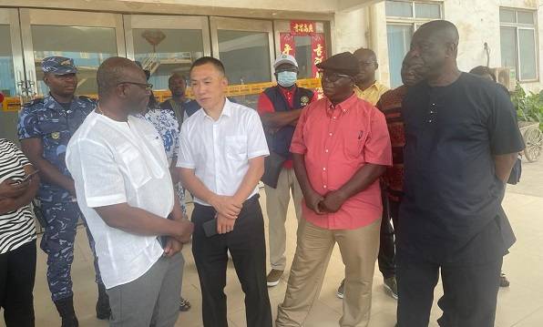 Mr Ofori-Atta (left) in discussion with Mr Gyamerah (second from right), Mr Zhu during the visit