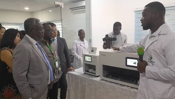 Dr Anthony Nsiah Asare (left) inspecting the equipment at the KOICA -KH lab.